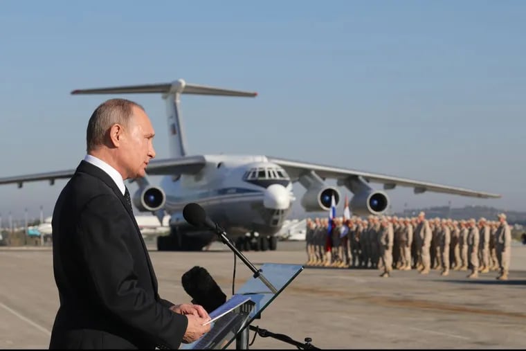 Russian President Vladimir Putin addresses the troops at the Hemeimeem air base in Syria on Monday, Dec. 11, 2017.