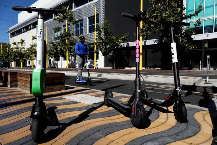 Electric scooters from Jump, Breeze Bike Share presented by Hulu, Bird, Lime and Lyft are on display at a news conference in Santa Monica, Calif., on September 17, 2018.