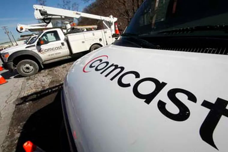 Comcast logos are displayed on installation trucks in Pittsburgh. Comcast Corp., the country's largest cable company, reported a 30 percent profit increase in the first quarter, beating expectations on the strength of Super Bowl advertising and its popular broadband service.   GENE J. PUSKAR / Associated Press, file