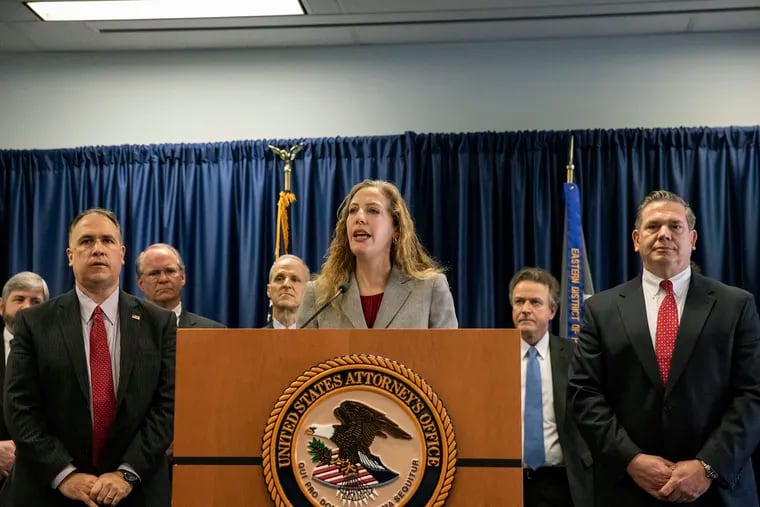 Jennifer Arbittier Williams, center, assistant United States Attorney with the Criminal Division of the U.S. Attorney's Office in Philadelphia, speaks next to Michael Harpster, right, FBI special agent of the Philadelphia Division, and Guy Ficco, left, of the IRS, regarding the indictment of Local 98 leader John "Johnny Doc" Dougherty at the U.S. Attorney's office in Center City Philadelphia on Wednesday, Jan. 30, 2019. Dougherty, a powerful union boss who has long held a tight grip on construction jobs in the Philadelphia region and wielded political power in the city and Statehouse, was indicted on embezzlement and fraud charges along with a city councilman and six others.