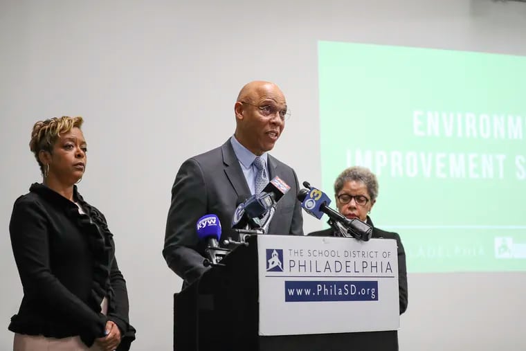 William Hite Jr., superintendent of the School District of Philadelphia (center), stands next to Councilwoman Cindy Bass, left, and Board of Education President Joyce Wilkerson at the Philadelphia School District headquarters in 2019. The school board's new public comment policy violates Pennsylvania law, a suit filed Friday by the ACLU on behalf of two community groups says.