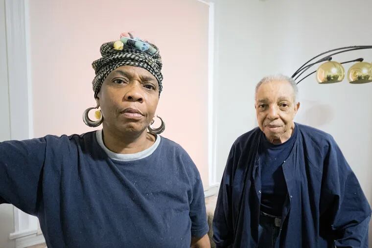 George Saunders, 86, and wife Priscilla Jones, 55, were abducted by three women on Friday in Southwest Philadelphia, police said. The couple is pictured at their home April 25, 2015. (ED HILLE / Staff Photographer )