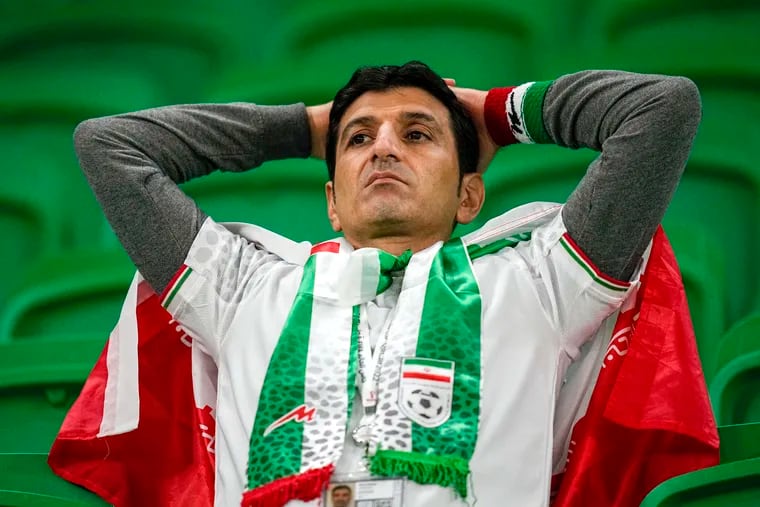 A fan of Iran's soccer team looks on at the end of the World Cup loss to the United States at the Al Thumama Stadium in Doha, Qatar.