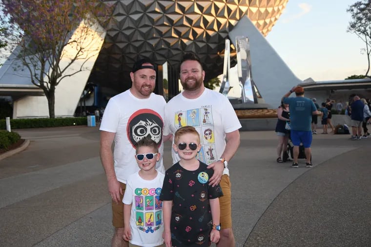 Sean (left) and Rich with Nolan and Christian at Disney, on a recent extended-family trip.