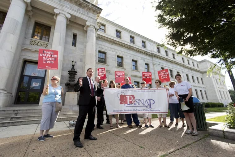 Nurses and their supporters rally outside the Delaware County Courthouse to complain about conditions since Prospect took over the Crozer-Keystone Health System.