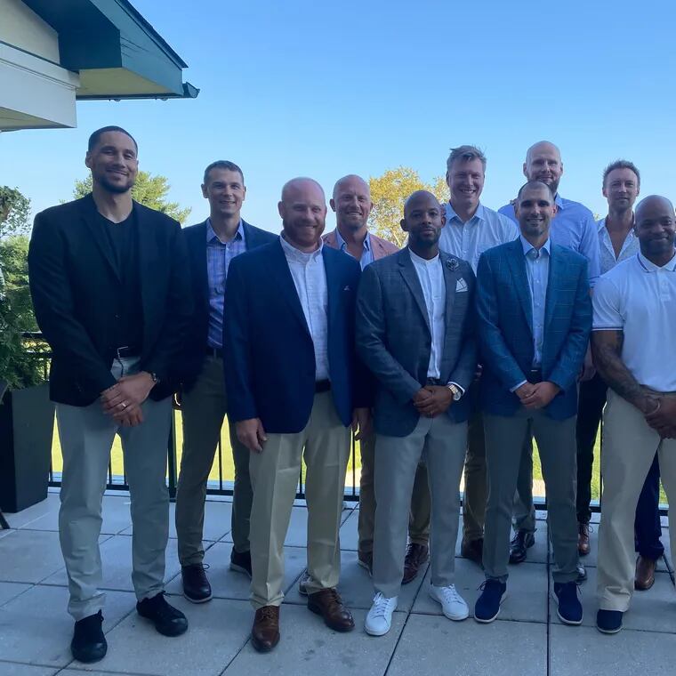 Members of the 2003-04 St. Joseph’s basketball team gather at Llanerch Country Club to commemorate the 20th anniversary of the team’s run to the Elite Eight.