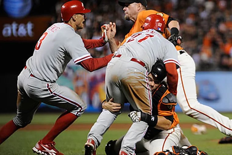 Giants catcher Eli Whiteside (right) was not suspended for his role in Friday's brawl. (Jose Carlos Fajardo/Bay Area News Group/AP)