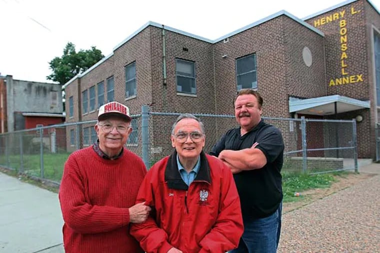 From left to right, Walt Piatek, recording secretary, Dan Steiner, First vice president, and Paul Matyjasik, director, are officeres in the Polish-American Citizens Club that use to meet at the corner of Lowell and Warsaw in Camden. The building behind them is their old meeting house. ( Michael Bryant / Staff Photographer )