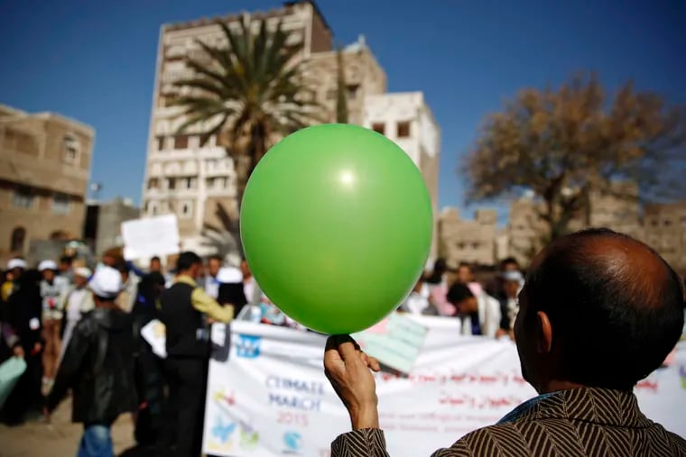A Yemeni protester holds a balloon during a march in Sana'a, Yemen. &quot;We want a better future for our children,&quot; an organizer of the Sana'a march said.