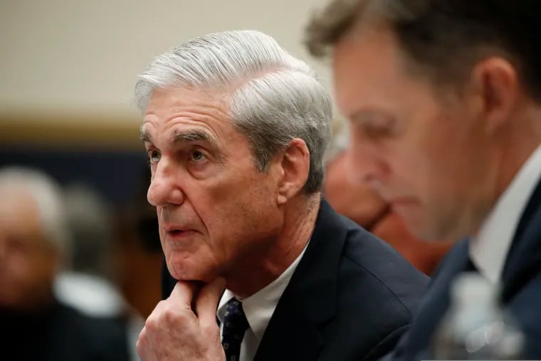 Former special counsel Robert Mueller, accompanied by his top aide in the investigation Aaron Zebley, right, testifies before the House Judiciary Committee on Wednesday.