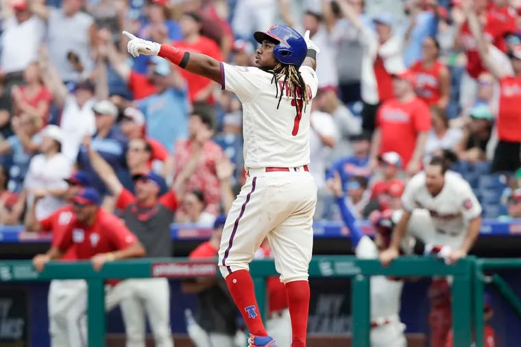 Phillies Maikel Franco raises his arms after hitting the game winning solo home run.