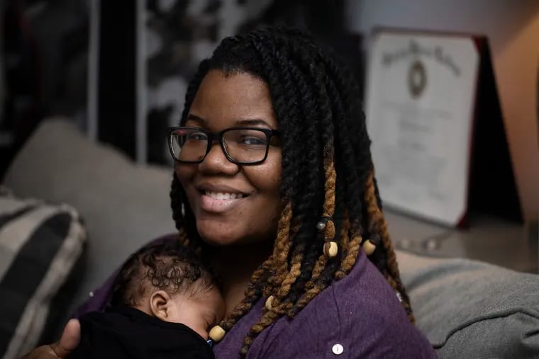 Madison Cook holds her six-week-old baby, Sydney at her home in Philadelphia, in March. A 2nd-year surgery resident at Temple University Hospital, Cook posted on social media about how she had warning signs of preeclampsia but had to fight to be admitted to Einstein Hospital.