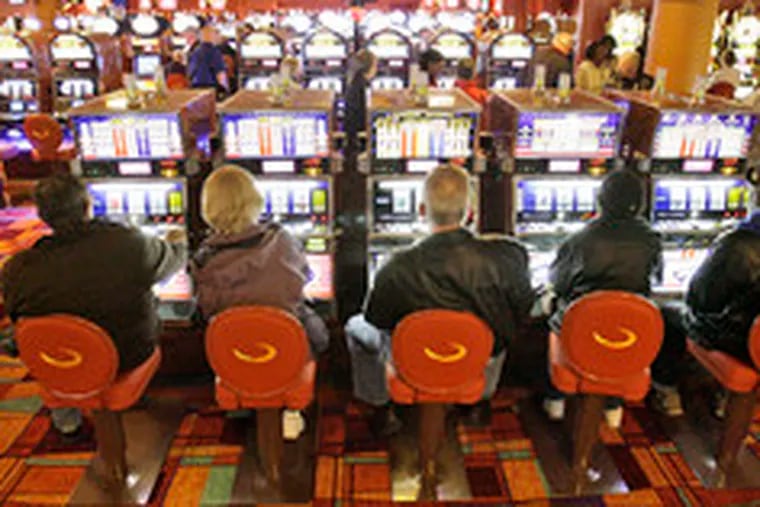Slots at the Philadelphia Park Casino in Bensalem. A group accused the owner of reneging on a plan to build a $300 million parlor.