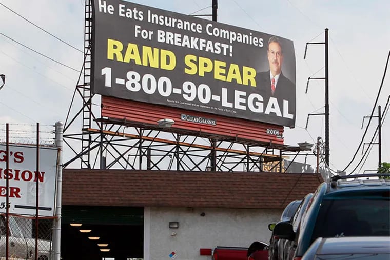 Rand Spear's billboard along I-95 near the Cottman Avenue exit, an example of the wide use of ads by lawyers.