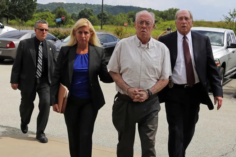 Rev. John T. Sweeney arrives Monday for a court appearance in Leechburg, Pa.
