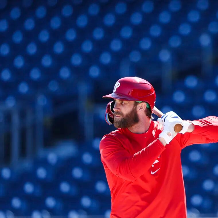 Phillies slugger Bryce Harper gets in some batting practice during spring training at BayCare Ballpark in Clearwater, Fla. The Phillies first game is Saturday against the Toronto Blue Jays.