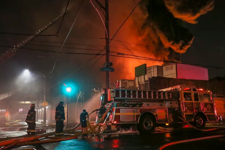 Firefighters battle the spectacular Kensington junkyard fire last month.