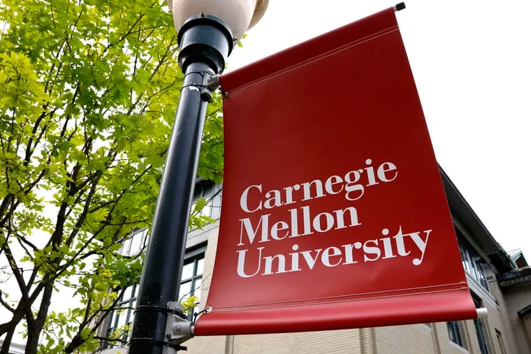 A Carnegie Mellon University sign is displayed outside Baker Hall on the university's campus in Pittsburgh.