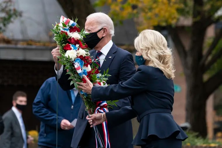 President-elect Joe Biden, and Jill Biden, place a wreath at the Philadelphia Korean War Memorial at Penn's Landing, on Veterans Day, Wednesday, Nov. 11, 2020, in Philadelphia. (AP Photo/Alex Brandon)