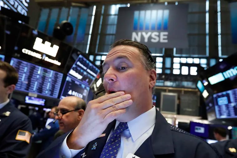 FILE - In this May 9, 2019, file photo trader Jonathan Corpina works on the floor of the New York Stock Exchange.