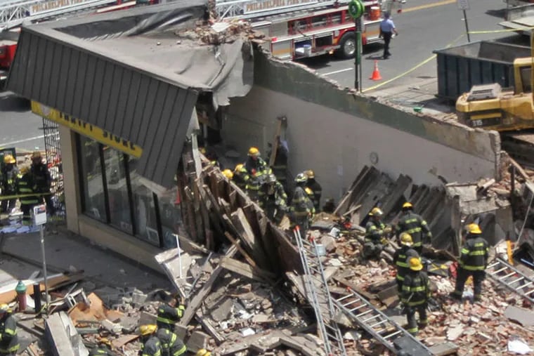 Emergency personnel searched the collapse site at 22d and Market on June 5, 2013.