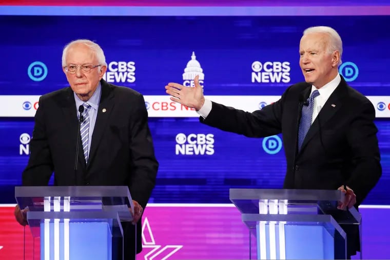 Democratic presidential candidates Bernie Sanders, left, and Joe Biden, right, during the presidential primary debate in Charleston, S.C., on Feb. 25, 2020.
