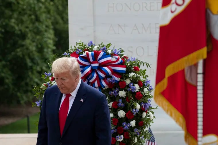 President Donald Trump turns after placing a wreath at the Tomb of the Unknown Soldier in Arlington National Cemetery, in honor of Memorial Day, Monday, May 25, 2020, in Arlington, Va.