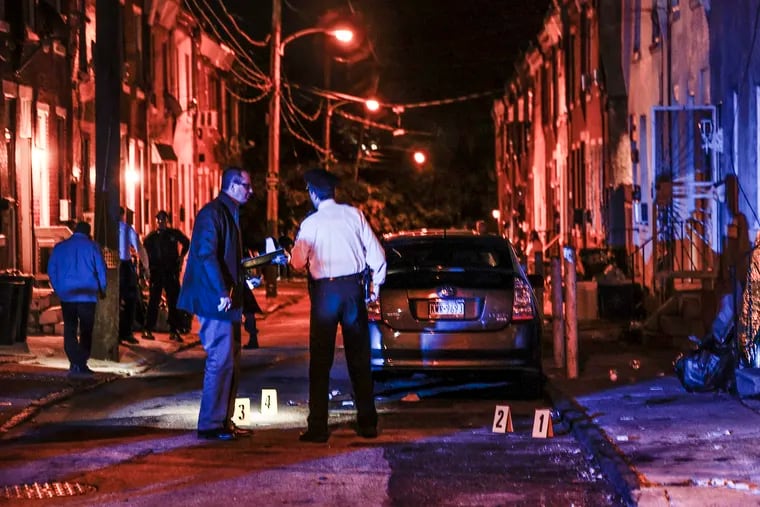 Police investigating a shooting at Lippincott and Amber Streets in Kensington earlier this month. A recent audit found that the response times for "priority 2" 911 calls, which include car crashes, could exceed 40 minutes.