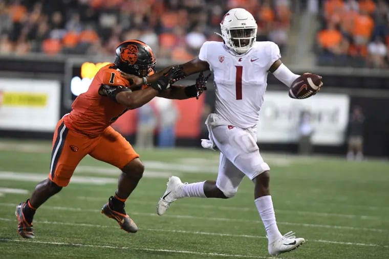 Oregon State linebacker Omar Speights chases down Washington State quarterback Cameron Ward in October.