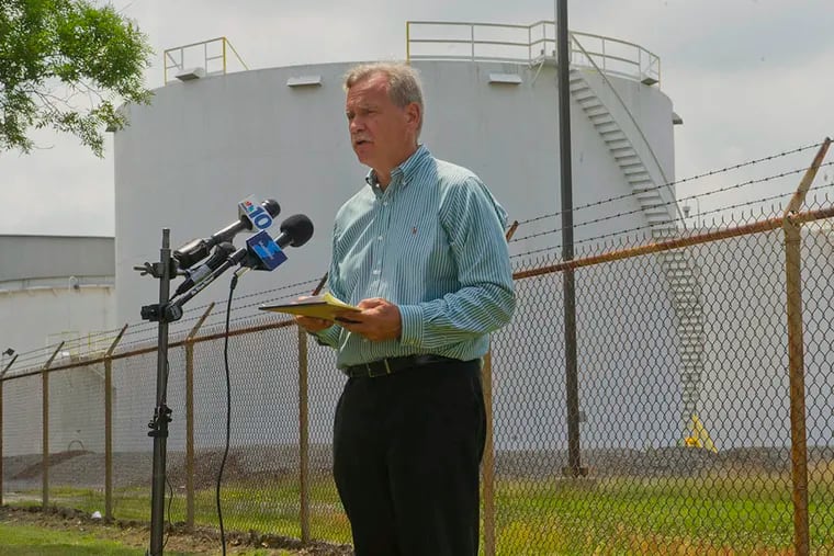 Jeff Tittel, New Jersey Sierra Club director, with Exxon’s old terminal site in the background. He said Paulsboro was “not going to see a penny” of the settlement. (Avi Steinhardt/For The Inquirer)