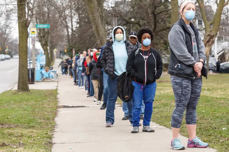 A line to vote in Wisconsin's spring primary election wraps around blocks.