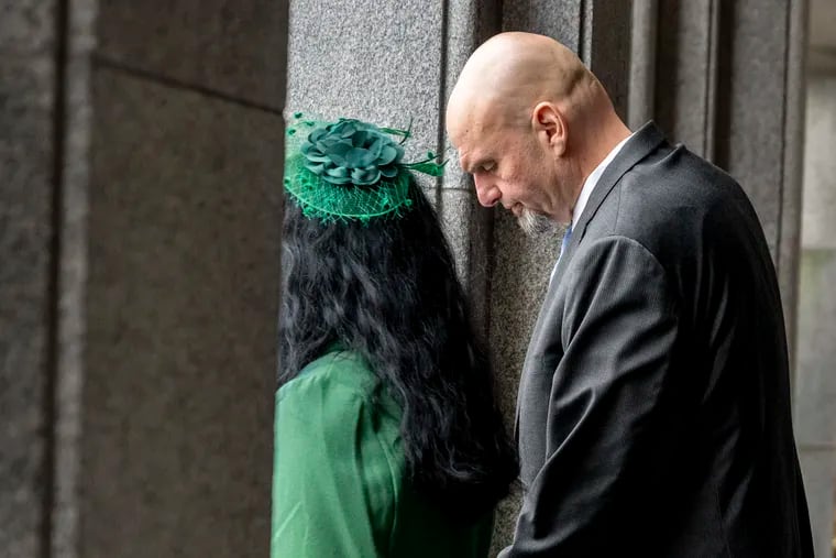 Sen. John Fetterman (D., Pa.) and his wife Gisele wait backstage to walk from the Capitol building in Harrisburg to the inauguration ceremonies for Gov. Josh Shapiro on Jan. 17.