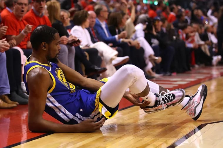 Kevin Durant (35) of the Golden State Warriors reacts after sustaining an injury during the second quarter against the Toronto Raptors during Game Five of the 2019 NBA Finals at Scotiabank Arena on Monday, June 10, 2019 in Toronto, Canada.