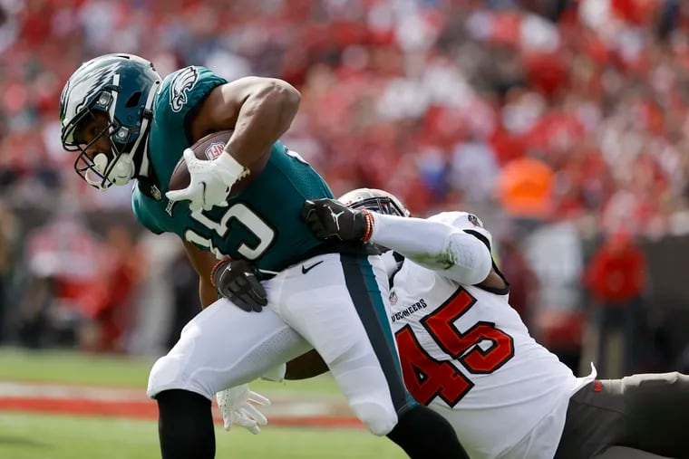 Philadelphia Eagles running back Boston Scott (35) makes the catch against Tampa Bay Buccaneers inside linebacker Devin White (45) during the first quarter Sunday, January 16, 2022 at at Raymond James Stadium in Tampa, Fla. Third down, 8:55 left in the first.