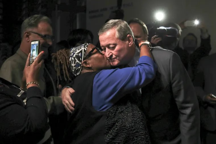 Mayor-elect Jim Kenney gets a kiss as he celebrates his victory with supporters at the National Museum of American Jewish History on Tuesday, Nov. 3, 2015.