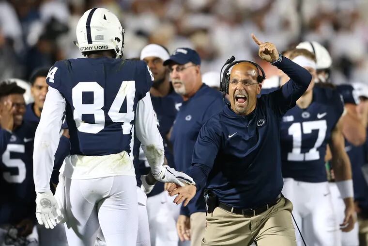 Penn State head coach James Franklin celebrates a touchdown with Penn State wide receiver Juwan Johnson (84) during a game at Penn State University's Beaver Stadium on Saturday, Sept. 29, 2018.