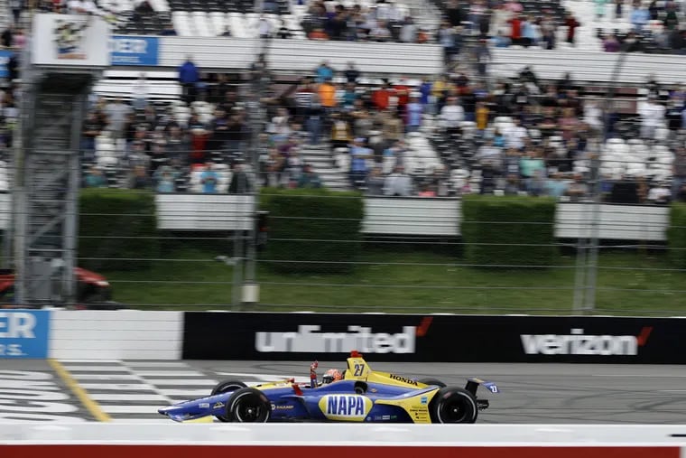 Alexander Rossi crosses the finish line to win the ABC Supply 500 at Pocono Raceway on Sunday.