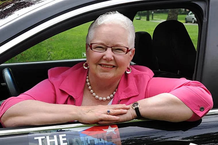 Patti Sheehy is so excited about getting her book published that she had car magnets made up to advertise it as she drives around in Haddon Heights. (CLEM MURRAY / Staff Photographer)