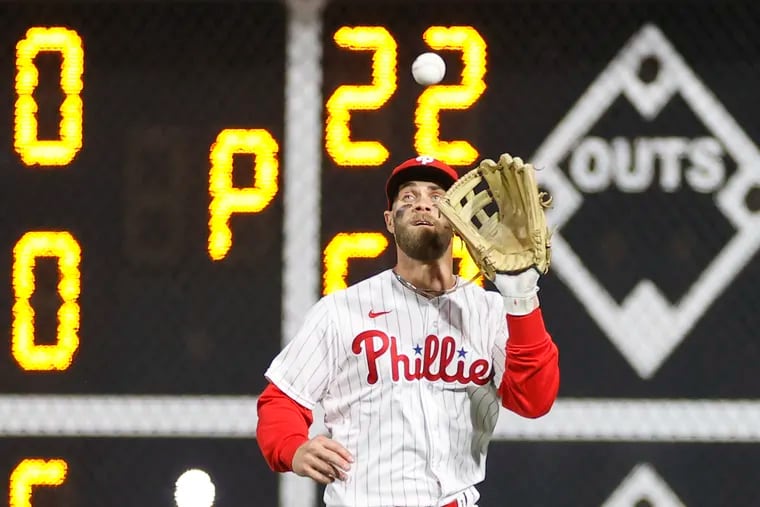 Phillies right fielder Bryce Harper is unlikely to play the outfield this week because he's dealing with a right elbow strain.
