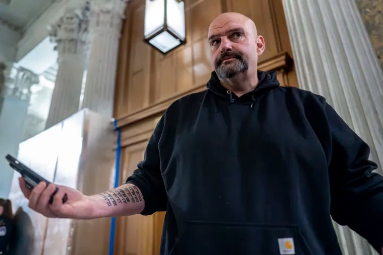 Sen. John Fetterman (D., Pa.) arrives as the Senate holds a procedural vote on a package of wartime funding for Ukraine, Israel and other U.S. allies in February.