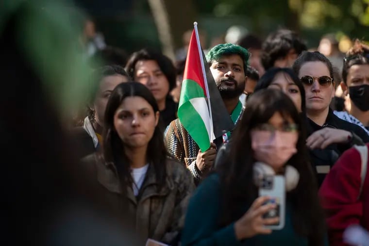 Penn students and supporters walk out of classes in support of Palestine and in criticism over president Liz Magill’s comments on Monday, Oct. 16, 2023.