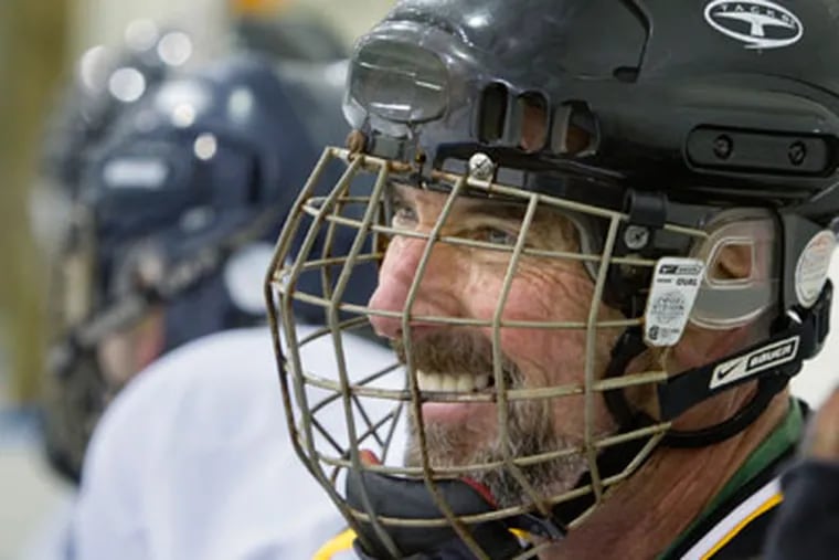 Frank Clamer, 53, of West Chester, smiles while waiting for a line change on the bench. (Ed Hille / Staff Photographer)