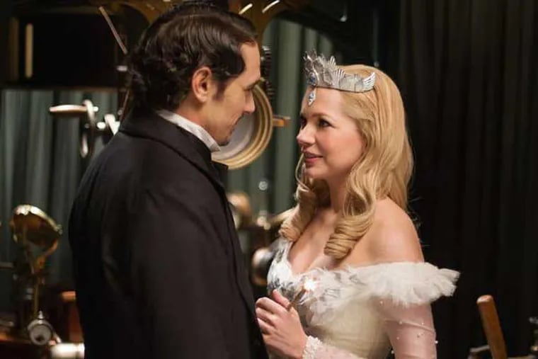 This film image released by Disney Enterprises shows James Franco, left, and Michelle Williams in a scene from "Oz the Great and Powerful." (AP Photo/Disney Enterprises, Merie Weismiller Wallace)