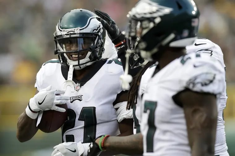 Eagles' defensive back Patrick Robinson (left) celebrates his fumble recovery during the first-quarter against the Green Bay Packers in a preseason game at Lambeau Field in Green Bay WI on Thursday, August 10, 2017. YONG KIM / Staff Photographer