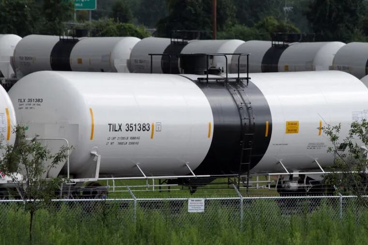 Railroad tank cars are unloaded on a loop track at a refinery in Delaware City, Delaware. July 28, 2013. The refinery receives 110,000 barrels of crude oil a day, which is about 150 cars, or two trainloads. The shipments originate in the Bakken region of North Dakota, the center of a new American oil boom. With a shortage of new pipeline capacity, oil producers have been using rail as an alternative, and in some cases it's the preferred mode.  (Curtis Tate/MCT)