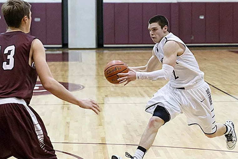 Conestoga's Zack Yonda drives to the basket during a December game against Radnor. (Photo credit: Tom Weishaar)