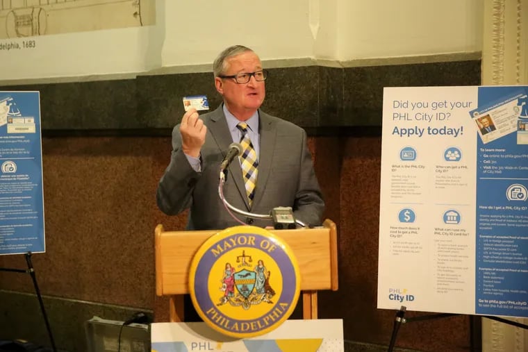 Philadelphia Mayor Jim Kenney holds up his Philadelphia municipal ID during a speech outside the walk-in Philly 311 service center in City Hall in Center City Philadelphia, PA on Thursday, April 4, 2019. The municipal IDs are designed to provide identification that people need to access social services, apply for housing and jobs, and open bank accounts.