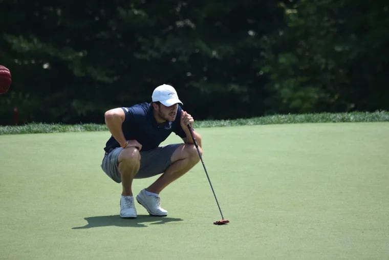 Penn State's Patrick Sheehan, the 36-hole leader of the Pennsylvania Amateur Championship, lines up a putt Tuesday on the eighth green at Merion Golf Club.