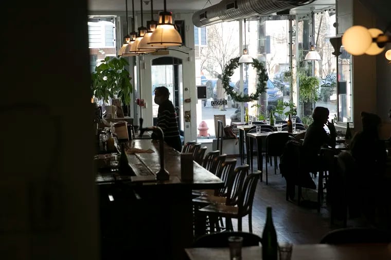 Brunch patrons are silhouetted as they dine at Fitz & Starts in Queen Village in January 2022.