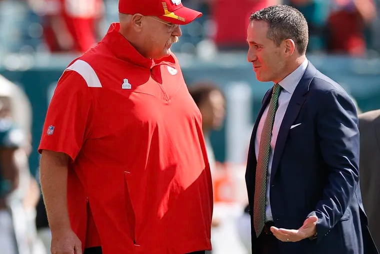 Kansas City coach Andy Reid meets with Eagles general manager Howie Roseman before the teams played  on Oct. 3, 2021.